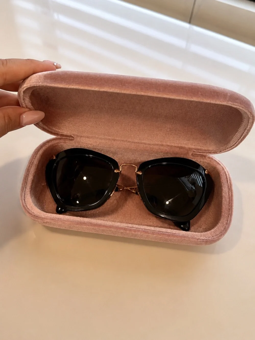 Miu Miu Classic Black Cat-Eye Sunglasses with Gold Accents